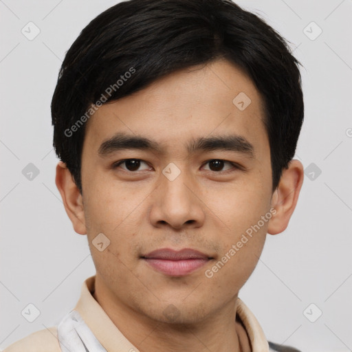 Joyful asian young-adult male with short  black hair and brown eyes