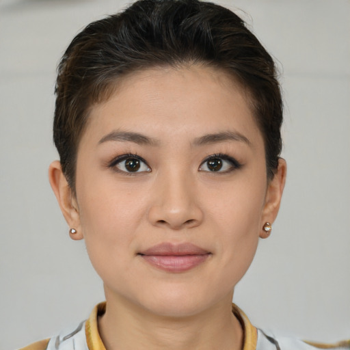 Joyful white young-adult female with short  brown hair and brown eyes