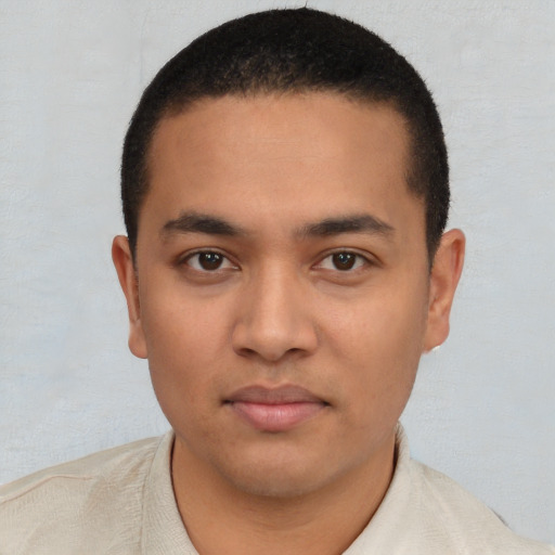 Neutral latino young-adult male with short  black hair and brown eyes