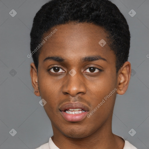 Joyful black young-adult male with short  black hair and brown eyes