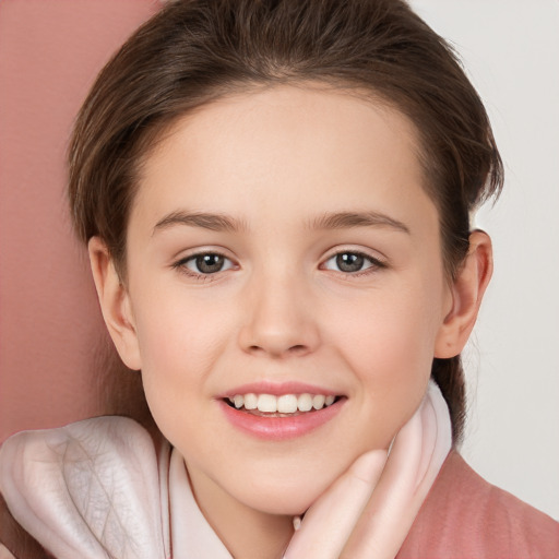 Joyful white child female with medium  brown hair and brown eyes