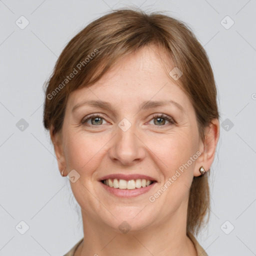 Joyful white adult female with medium  brown hair and grey eyes