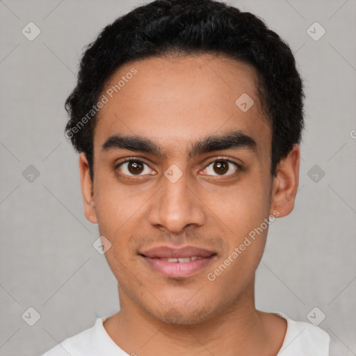 Joyful latino young-adult male with short  black hair and brown eyes