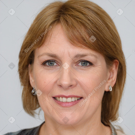 Joyful white adult female with medium  brown hair and grey eyes