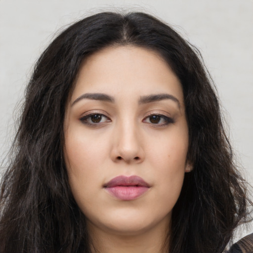 Joyful asian young-adult female with long  brown hair and brown eyes