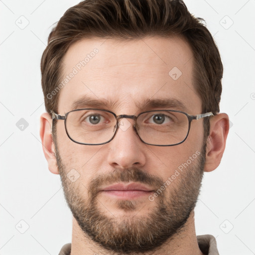 Joyful white young-adult male with short  brown hair and grey eyes