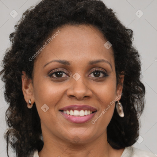 Joyful black young-adult female with medium  brown hair and brown eyes