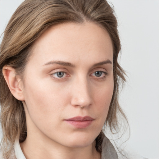 Neutral white young-adult female with medium  brown hair and grey eyes