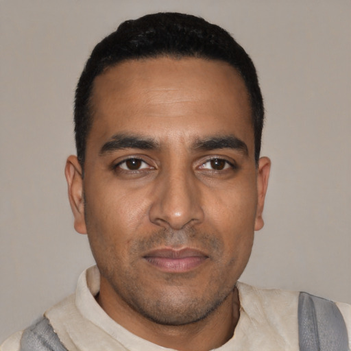 Neutral black young-adult male with short  black hair and brown eyes