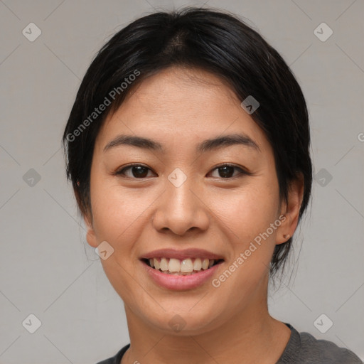 Joyful asian young-adult female with medium  black hair and brown eyes