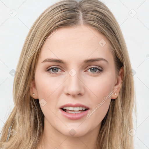 Joyful white young-adult female with long  brown hair and green eyes