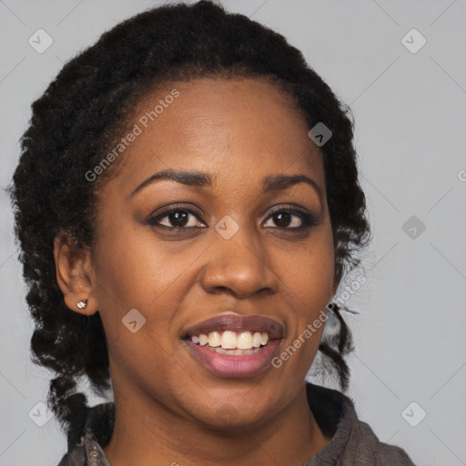 Joyful black young-adult female with long  brown hair and brown eyes