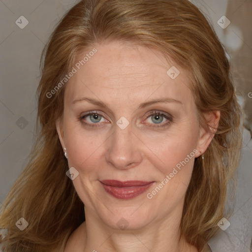 Joyful white adult female with medium  brown hair and blue eyes