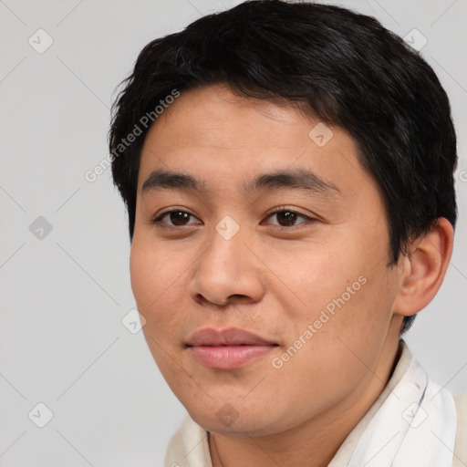 Joyful asian young-adult male with short  brown hair and brown eyes