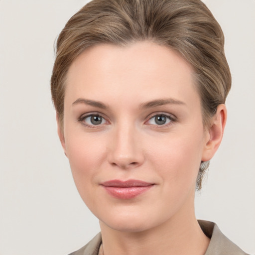 Joyful white young-adult female with medium  brown hair and grey eyes