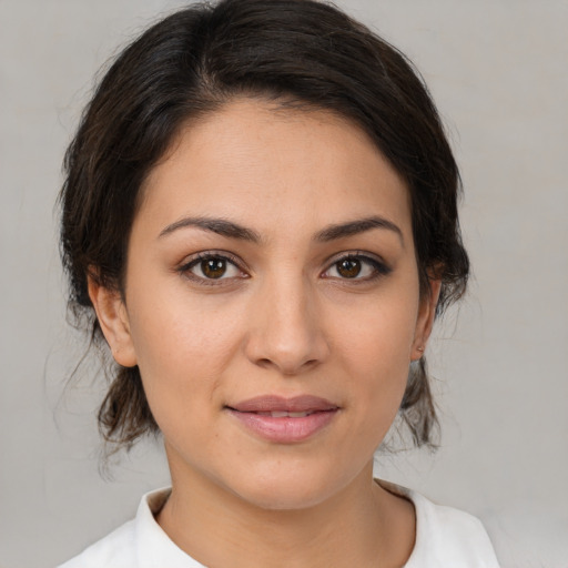Joyful white young-adult female with medium  brown hair and brown eyes