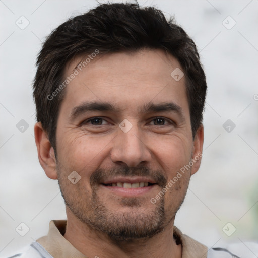 Joyful white young-adult male with short  black hair and brown eyes