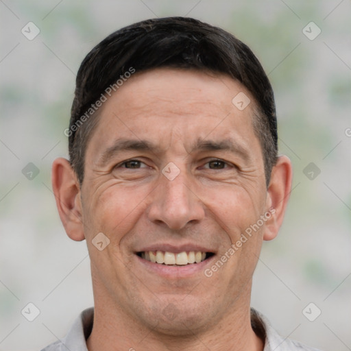 Joyful white adult male with short  brown hair and brown eyes