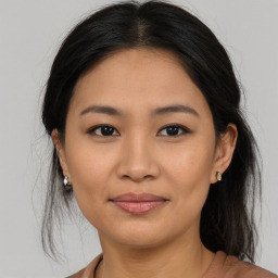 Joyful asian young-adult female with medium  brown hair and brown eyes