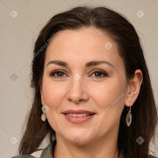 Joyful white adult female with long  brown hair and brown eyes