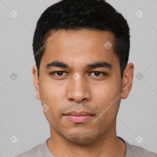 Neutral latino young-adult male with short  black hair and brown eyes