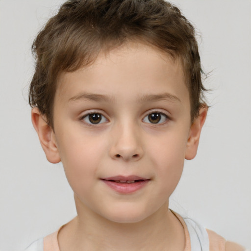 Joyful white child male with short  brown hair and brown eyes