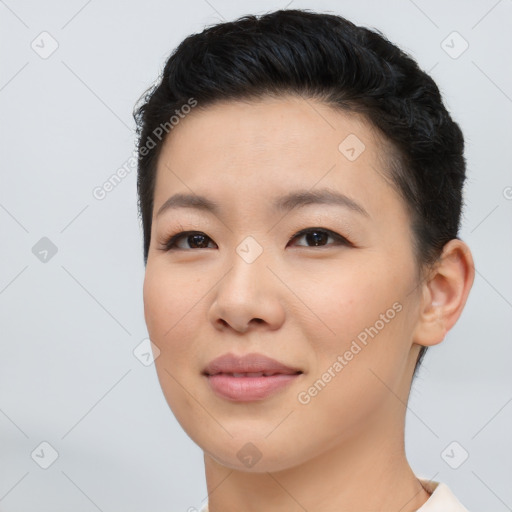 Joyful asian young-adult female with short  black hair and brown eyes