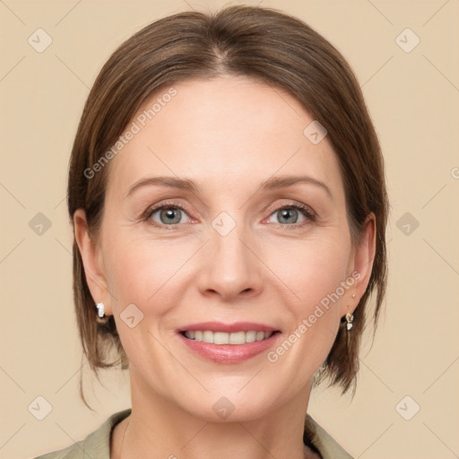 Joyful white adult female with medium  brown hair and grey eyes