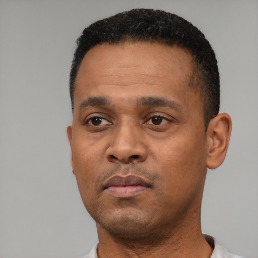 Neutral black adult male with short  black hair and brown eyes