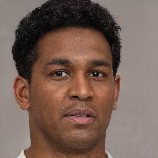 Neutral black young-adult male with short  brown hair and brown eyes