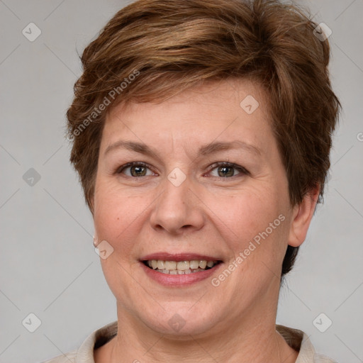 Joyful white adult female with short  brown hair and grey eyes