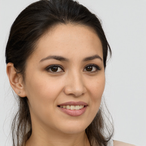 Joyful white young-adult female with long  brown hair and brown eyes