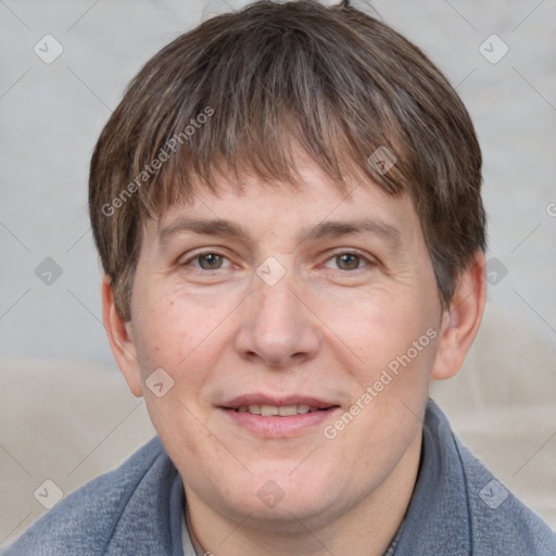 Joyful white adult male with short  brown hair and grey eyes