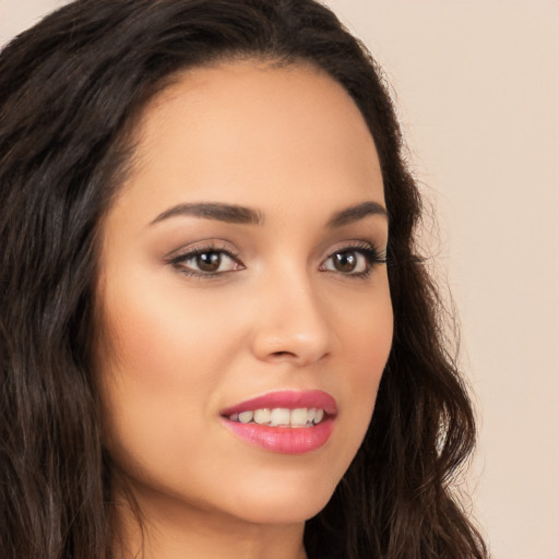 Joyful white young-adult female with long  brown hair and brown eyes