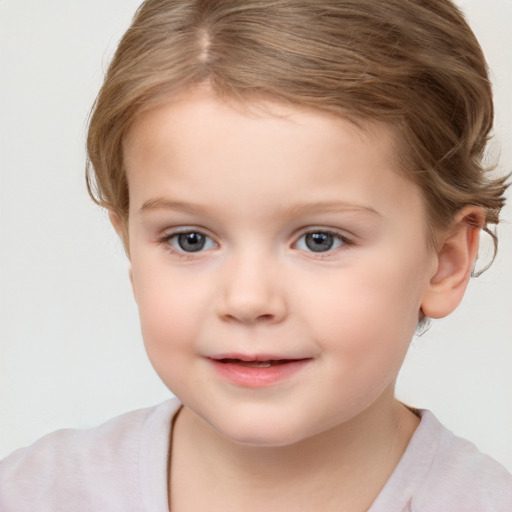 Joyful white child female with short  brown hair and grey eyes