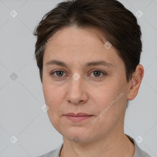 Joyful white adult female with short  brown hair and brown eyes