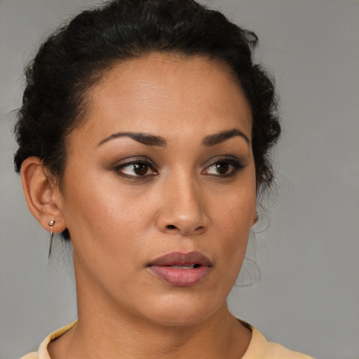 Neutral latino young-adult female with short  brown hair and brown eyes