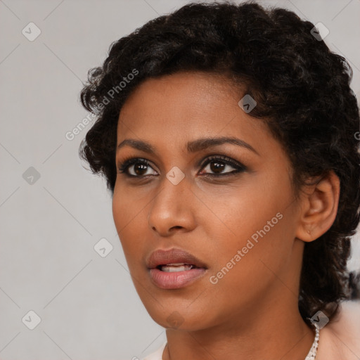 Neutral black young-adult female with short  brown hair and brown eyes