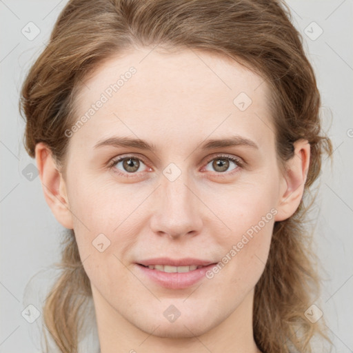 Joyful white young-adult female with medium  brown hair and blue eyes