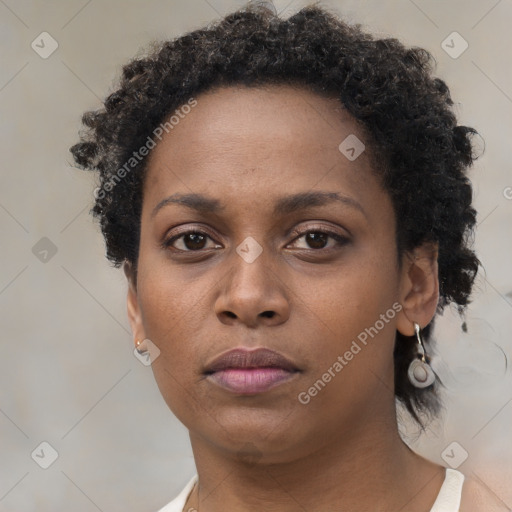 Neutral black young-adult female with short  brown hair and brown eyes