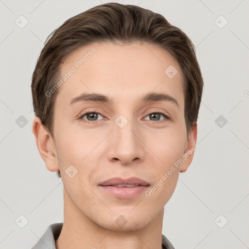 Joyful white young-adult male with short  brown hair and grey eyes