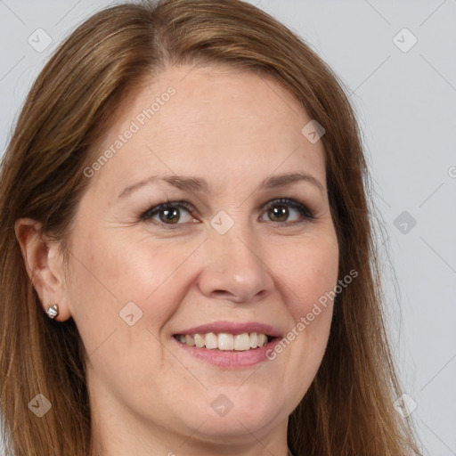 Joyful white adult female with long  brown hair and brown eyes