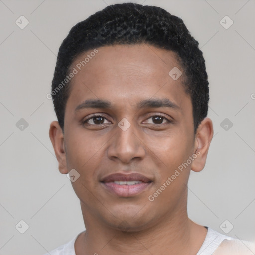 Joyful black young-adult male with short  black hair and brown eyes