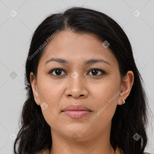 Joyful latino young-adult female with long  brown hair and brown eyes