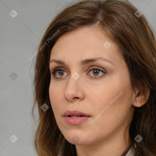 Neutral white young-adult female with long  brown hair and brown eyes