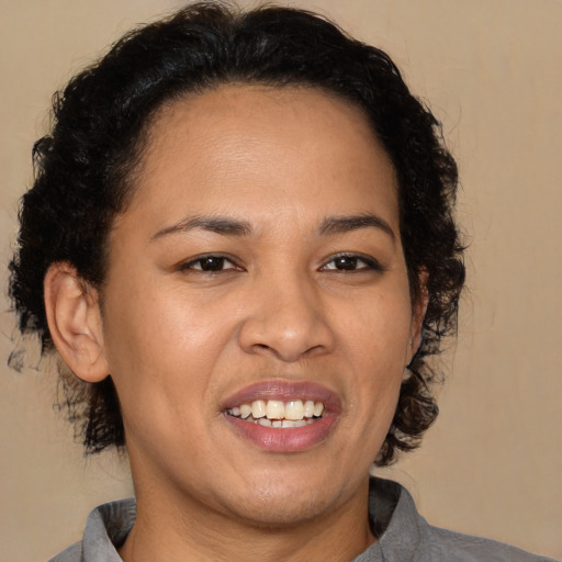 Joyful latino young-adult female with short  brown hair and brown eyes
