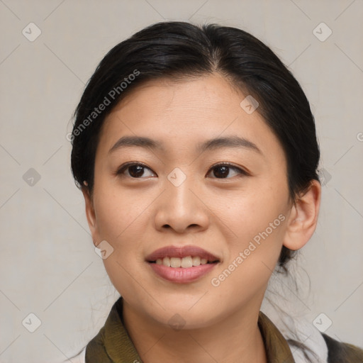 Joyful asian young-adult female with medium  brown hair and brown eyes