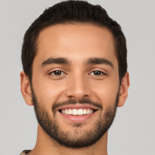 Joyful white young-adult male with short  brown hair and brown eyes