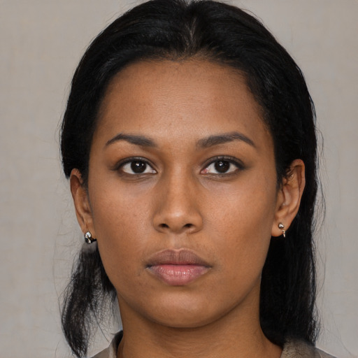Neutral black young-adult female with medium  black hair and brown eyes