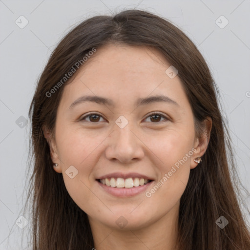 Joyful white young-adult female with long  brown hair and brown eyes